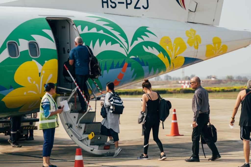 People boarding an ATR turboprop aircraft